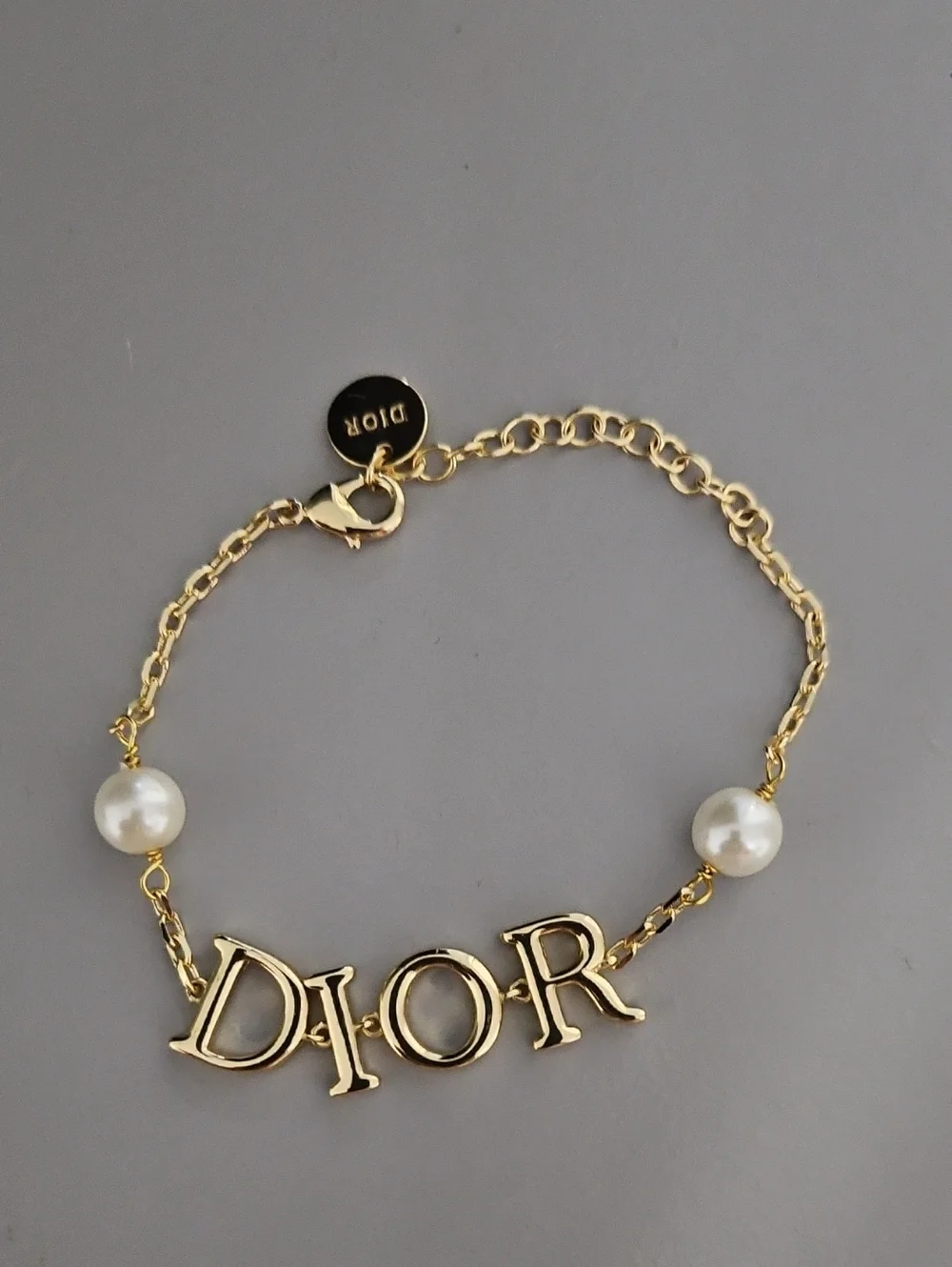 D Letter Gold Tone Logo Bracelet with Pearl Accents